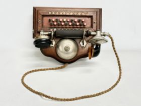 An early 20th century wall mounted telephone. British Manufacturer. 26x19x16cm