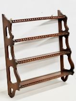 A mahogany 4 tier wall hanging whatnot open bookcase. 75x20x80cm