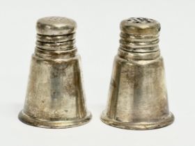 A pair of sterling silver salt and pepper shakers. 35.71 grams. International Sterling.