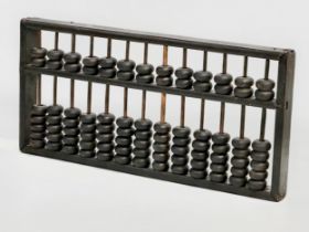 A late 19th/early 20th century Chinese Abacus. 35x17cm