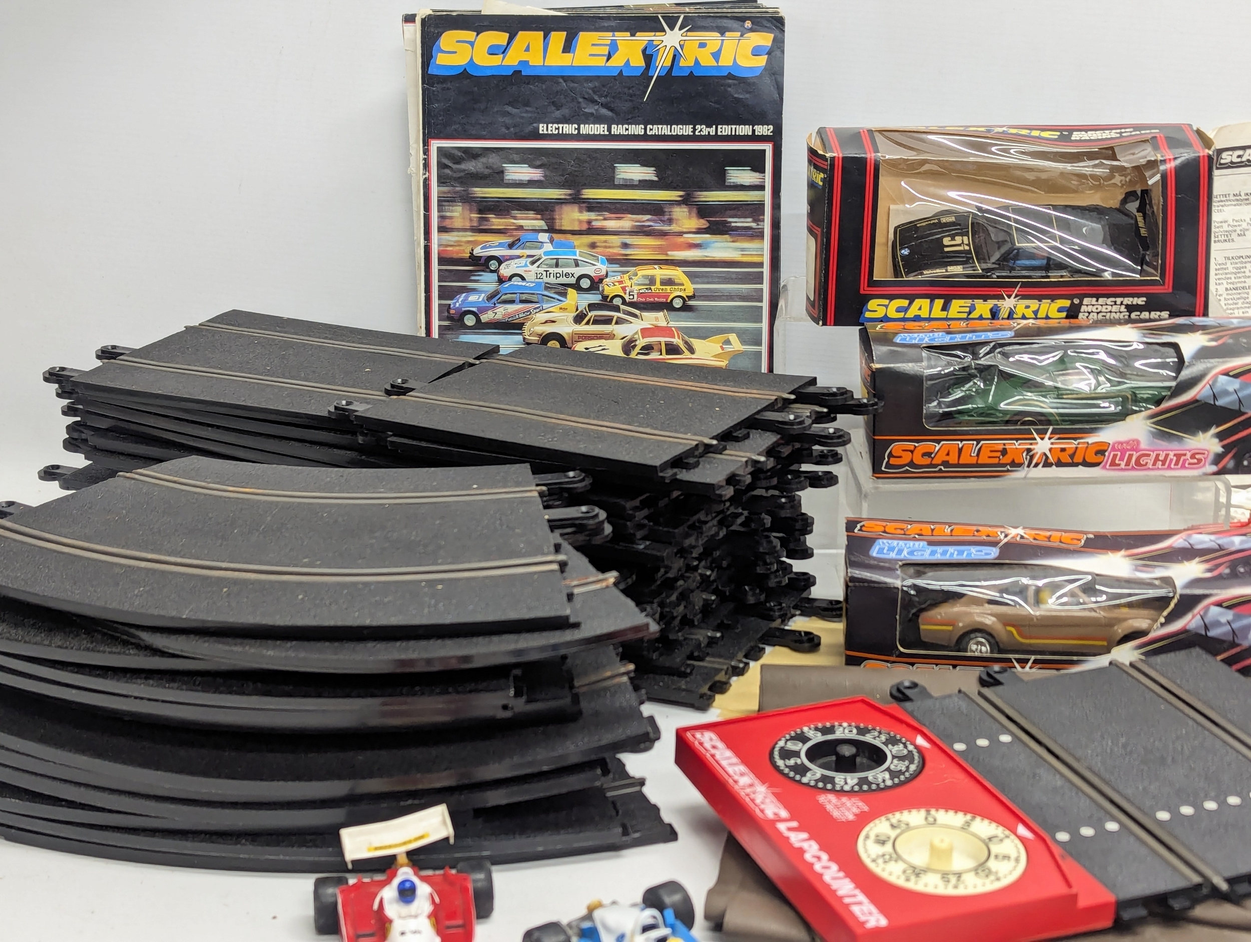 A collection of vintage Scalextric, including Power Unit, 2 remote controls, 3 boxed cars and 2