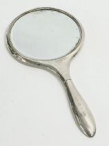 A late 19th/early 20th century silver vanity mirror. 14x27.5cm
