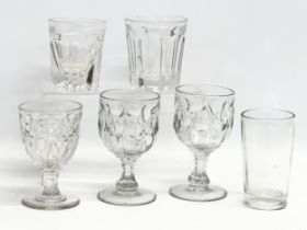A collection of early 20th century heavy cut glass drinking glasses. A tall early 20th century