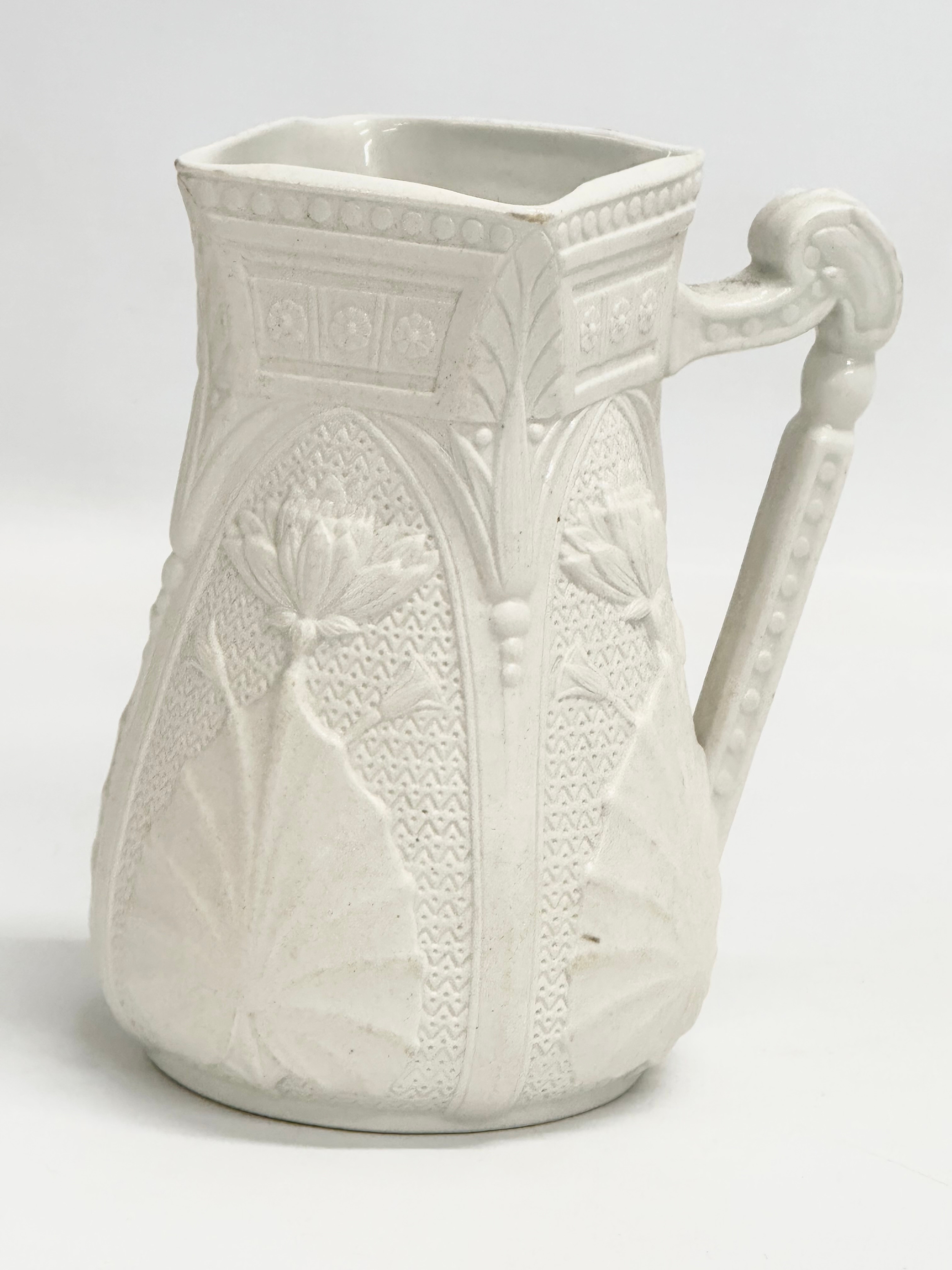 2 mid 19th century Copeland Parian Ware jugs. A Harvest Barrel jug 13x18cm. - Image 2 of 6