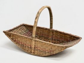 A 1930’s wicker garden basket. 53x29x33cm