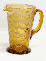 A vintage Amber Glass pitcher jug with Milk Glass drapes. Circa 1930-1950. 19x12x19cm