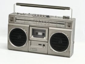 A vintage Hitachi stereo cassette recorder. Model TRK-7100E.