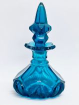 A mid 20th century blue cut glass perfume bottle/scent bottle. 16cm