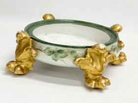 A late 19th century Jean Pouyat hand painted pottery jardiniere plinth with 4 clawed feet.