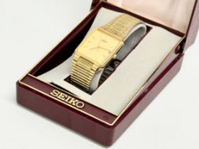 A vintage Seiko watch with case.