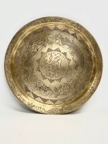 An early 20th century Chinese brass wall hanging tray. 29cm