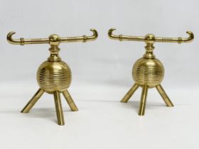 Christopher Dresser. A pair of good quality late 19th century brass fire andirons attributed to
