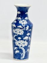 A late 19th century Chinese blue and white prunus baluster vase. Guangxu (1875-1908) 26cm