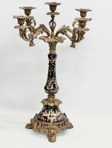 A large ornate brass and enamelled porcelain candelabra. 34x34x61cm