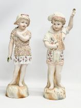 A pair of large late 19th/early 20th century German Bisque figurines. Heubach style. Circa 1900.