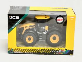 A new Britains JCB Fastrac 8330 tractor with box. 25x13x16cm