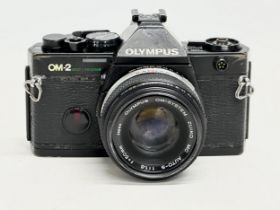 A vintage Olympus OM-2 camera.