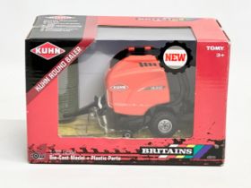 A new Britains Kuhn Round Baler with box. 20x12x13cm