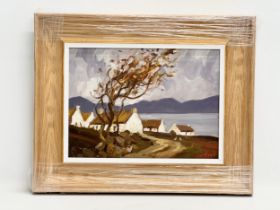 An oil painting on board by John U. Cottage and Mountain scene. 39x29cm. Frame 56x46cm