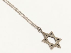 A silver Star of David pendant and chain. Stamped JDS. 3.54g