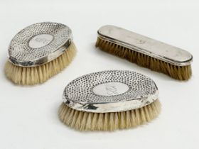 3 late 19th/early 20th century silver vanity brushes.