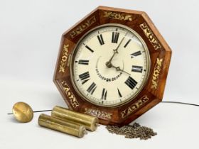 A Victorian rosewood Wag on the Wall clock with brass inlay. Weights and pendulum. Face measures