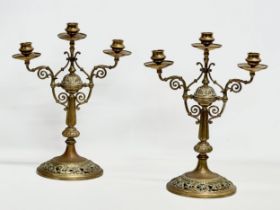 A pair of large Victorian pierced brass candelabras. 29x16.5x38cm