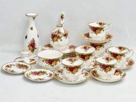A 25 piece 1962 Royal Albert ‘Old Country Roses’ tea set. Rose vase 19cm. A sugar jar with lid and