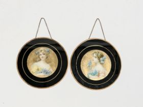 A pair of early 20th century paintings on prints of ladies with gilded metal frames. Circa 1900-