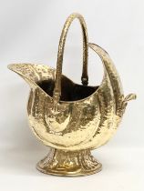 A large Victorian brass coal scuttle. 46x32x56cm