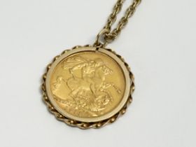 A full gold sovereign with pendant and chain. 1911. 15.55 grams with chain.