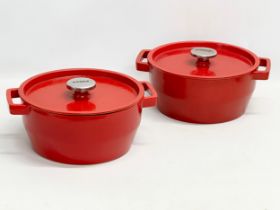 A pair of Pyrex cast iron casserole dishes. 30x25x14cm