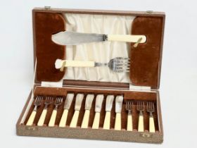 A vintage silver plated cutlery set with bone handles in case. 36.5x22x6cm