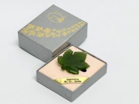 A vintage Pan Pacific Jade brooch with box. Brooch measures 3x3.5cm