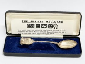 The Jubilee Silver Hallmark. A silver teaspoon to commemorate the Silver Jubilee of H.M. Queen