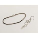 A silver bracelet and silver earring. 5.52g