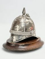 A 19th century Irish silver inkwell in the form of a British Military helmet. 17x16cm
