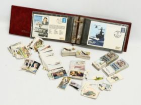 A collection of vintage cigarette cards and British Military themed Classic One Cover Album.