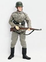 A Dragon Models LTD WWII German infantry action figure. 32cm