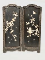 An early 20th century Japanese carved framed 2 tier screen with bone lotus leaves and birds in