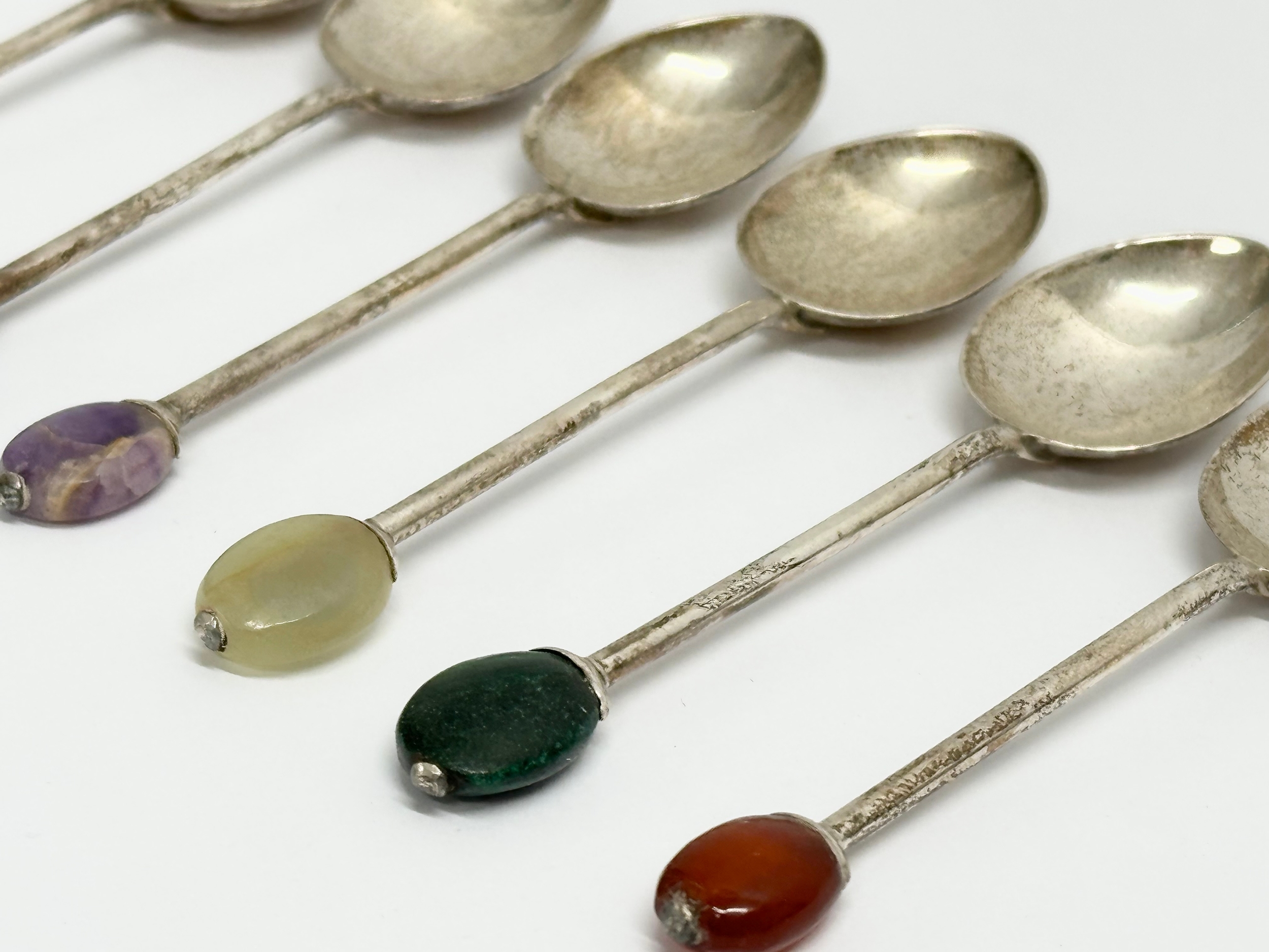 A set of 6 1920s Liberty & Co silver cocktail spoons with stone set handles in original case. - Image 6 of 7