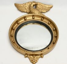 A vintage Regency style gilt framed convex mirror. 47x70cm
