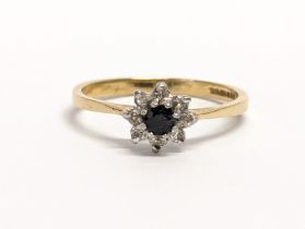 A vintage 9ct gold, diamond and sapphire ring. By LW Birmingham. Size N.