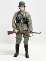 A Dragon Models LTD WWII German infantry action figure. 31cm
