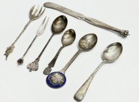 A collection of silver spoons and knife. Sterling Denmark crowned butter knife and pickle fork