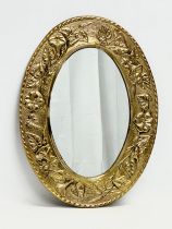 A vintage ornate brass framed mirror by Peerage. 30x39.5cm