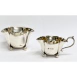 A Horace Woodward & Co Ltd silver sugar bowl and matching cream jug. Circa 1893-1919. London. 133.78