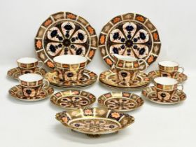An early 20th century 21 piece Royal Crown Derby Imari tea service. 2 cake plates, 4 cups, 6