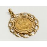 A George V gold sovereign pendant. 1913. 13.13 grams total.