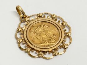 A George V gold sovereign pendant. 1913. 13.13 grams total.